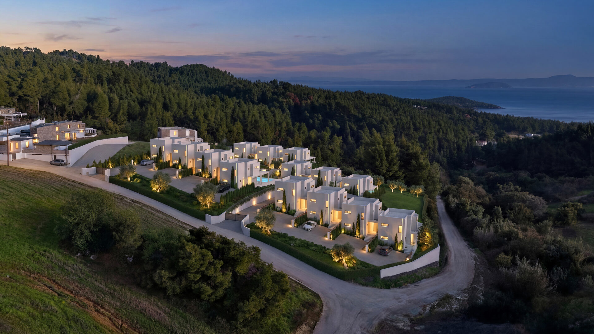 Luxury villa with infinity pool overlooking the Aegean Sea at sunset